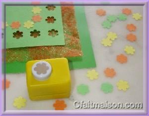 Perforatrice, confettis et perforations en forme de fleurs